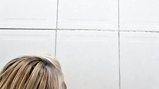 In the Bathroom, Sticking Dildo in Her Pussy