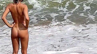 A Busty Blonde Is Walking and Sunbathing Naked