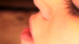 Busty brunette licks her lesbian lover's hot cunt on the sofa