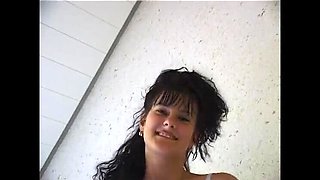 Hairy brunette cutie with small tits rubs her bushy snatch