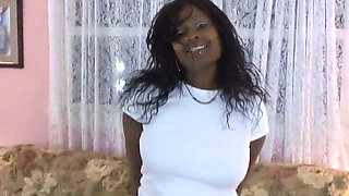 Hot black broad gets naked on couch