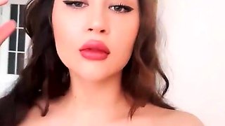 Brunette seductress working her big boobs and hot ass