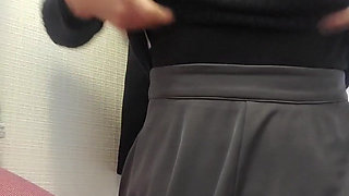 A Model Changing Clothes in the Waiting Room for a Photo Session