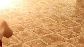 A Cute Little Dressed in a Jk Uniform Was Walking Around Barefoot on the Ground.