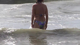 Milf goes on vacation to the beach with 18 year old stepson to teach him how to fuck