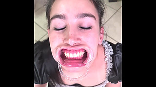 French Maid Tries to Swallow Her Own Piss Through Lip Retractor