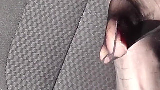 Feet of Nylonjunge in Pantyhose in Car