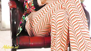 Floral blazer on red chair