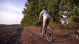 Cycling Outdoors And Flashing Ass In Miniskirt