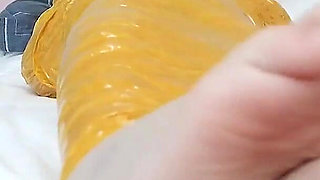 First-person Perspective Records the Girlfriend Wrapped in Tape From Head to Toe with Her Beautiful Bare Feet