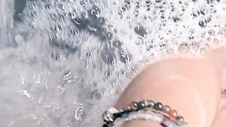 My pointing in the hot tub with the waterfall