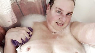 washing boobies in bath