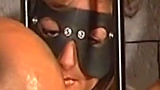 Blindfolded Brunette MILF Chained for Steamy Dungeon Play