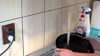 Hair Wash with Dishwasher Liquid in Kitchen Sink