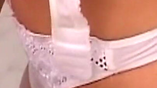 Mature Nurses Intimately Explore Patient on Exam Table