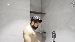 Bearded Indian dude fucks a Desi MILF in the shower from the back