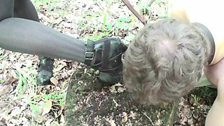 Mistress punishing her slave by putting high heels inside his mouth