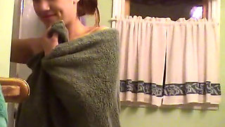 Cute brunette teen soaps up in the shower and takes time to trim her bush