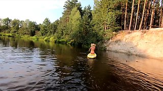 Tattooed Babe Strips and Swims on a SUP Board in the Forest