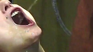 Big Tittied Blonde Tattooed Pierced Babe Pisses and Gets Pissed on by Two Men