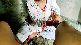 Desi stepmom Annuakhil gives her stepson a blowjob in the kitchen