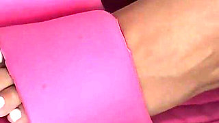 Tanned Feet in Pink Flip-flops