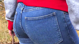 MILF In Blue Jeans Bends Over And Flashing Her Big Ass Outdoors