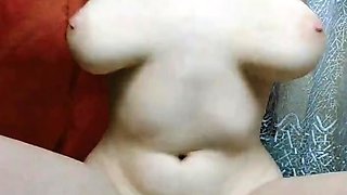 A beautiful blonde is riding a dildo