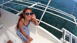 Asian babe with natural tits and long hair craves your cock in a secluded beachside blowjob